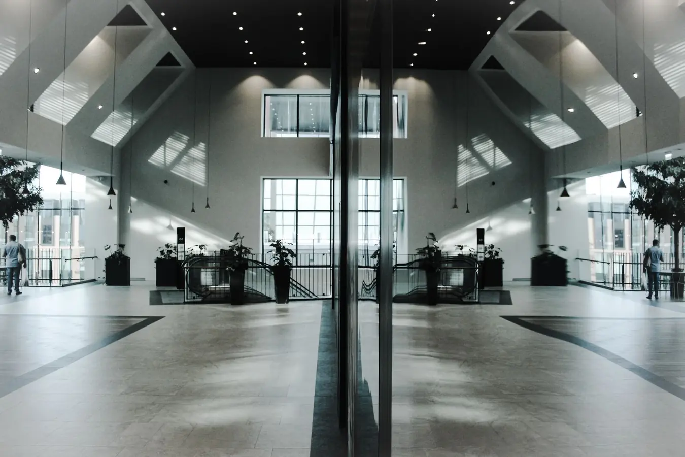 Day porter cleaning a commercial building lobby during business hours in Toronto
