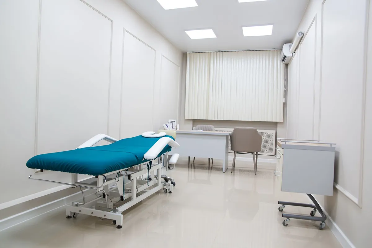 Illustrative medical examination room prepared for environmental cleaning