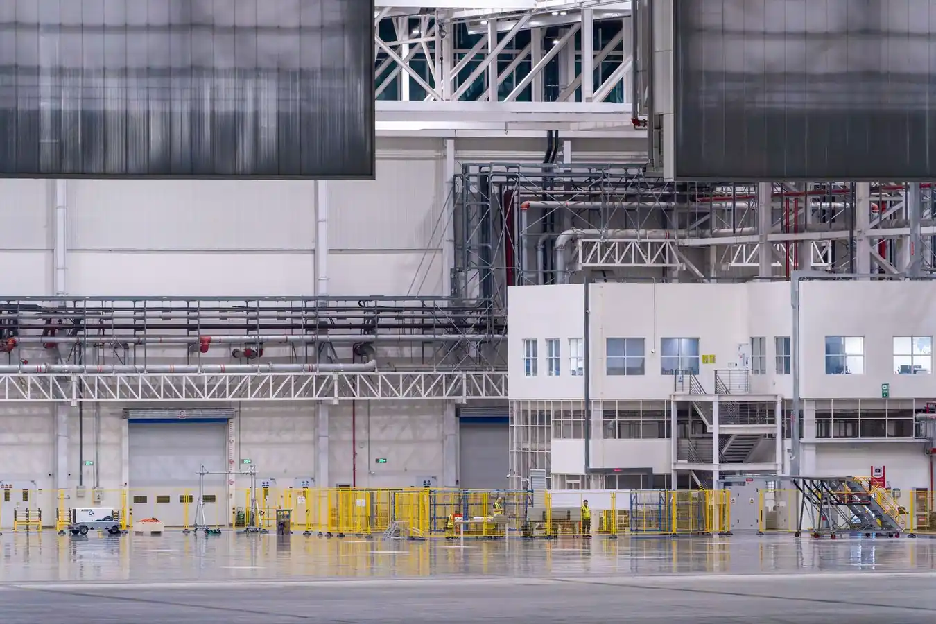 Factory floor interior with production machinery and clean walkways