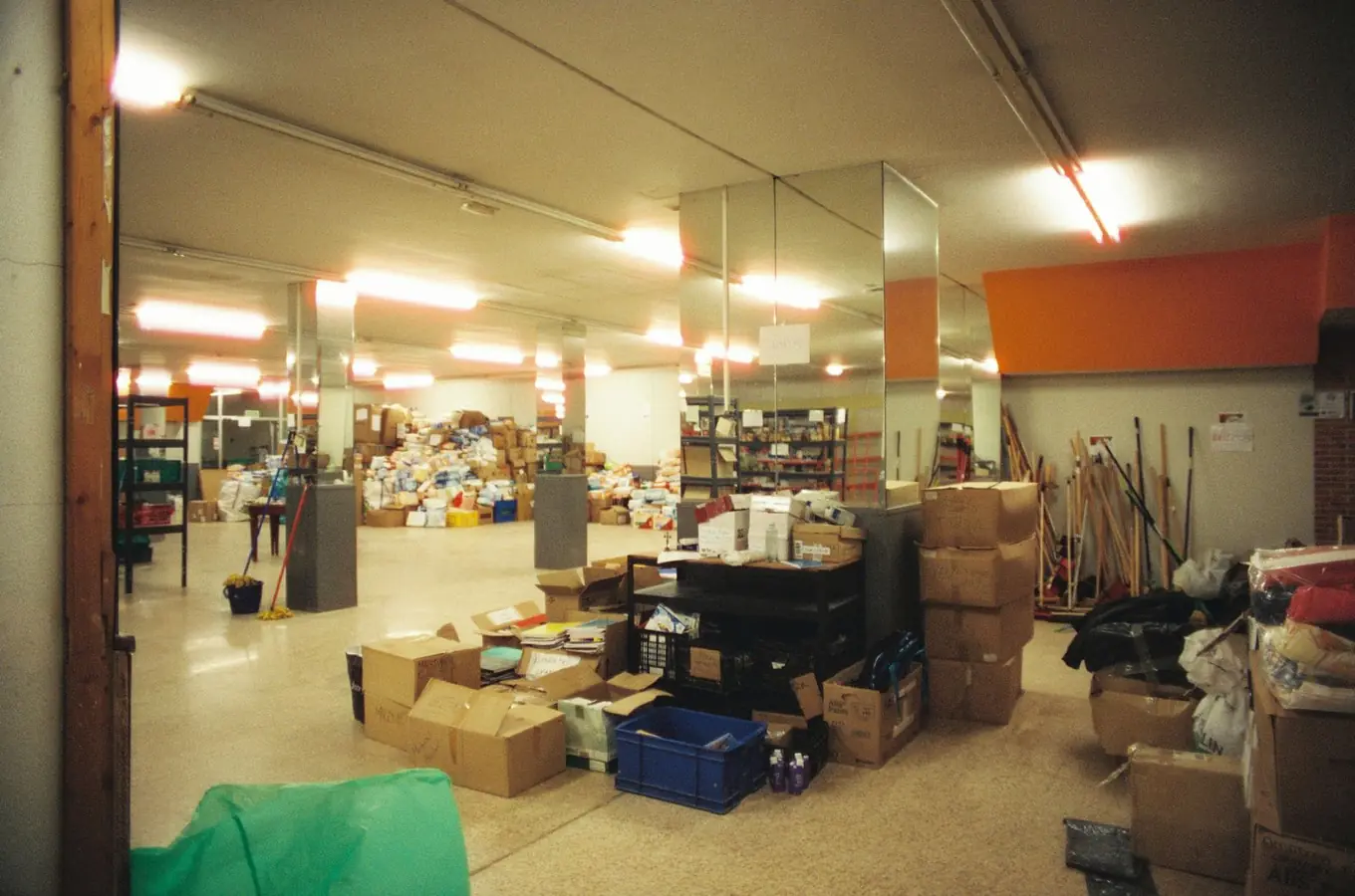 Clean warehouse aisle with racking and machine-scrubbed concrete floor