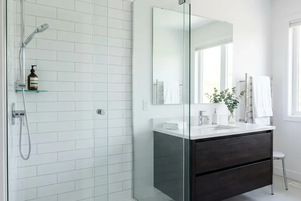Glass shower and vanity in a Toronto condo bathroom ready for a deep clean